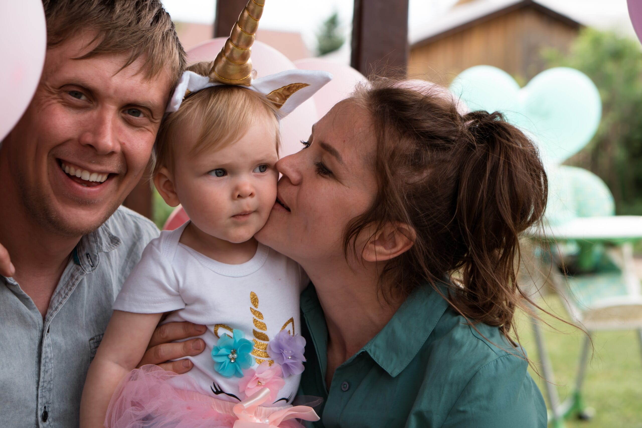 Parents with little kid at birthday party